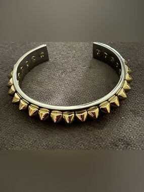 GOLD PLATED STUDS CUFF BRACELET SILVER TONE BACK MARKED UNKNOWN
STUDS CONFIRMED